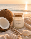 Ocean Breeze Jar — Fiji Coconut candle on the beach at sunset beside a coconut