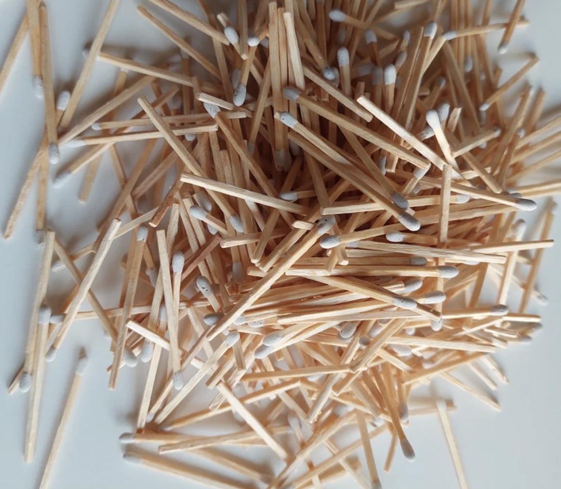 A pile of hand-rolled white-tipped matchsticks